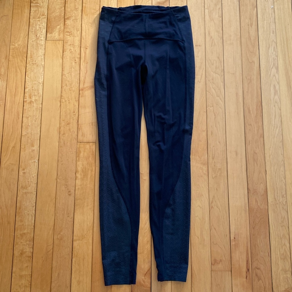 Black Lululemon leggings with mesh side. Size S.